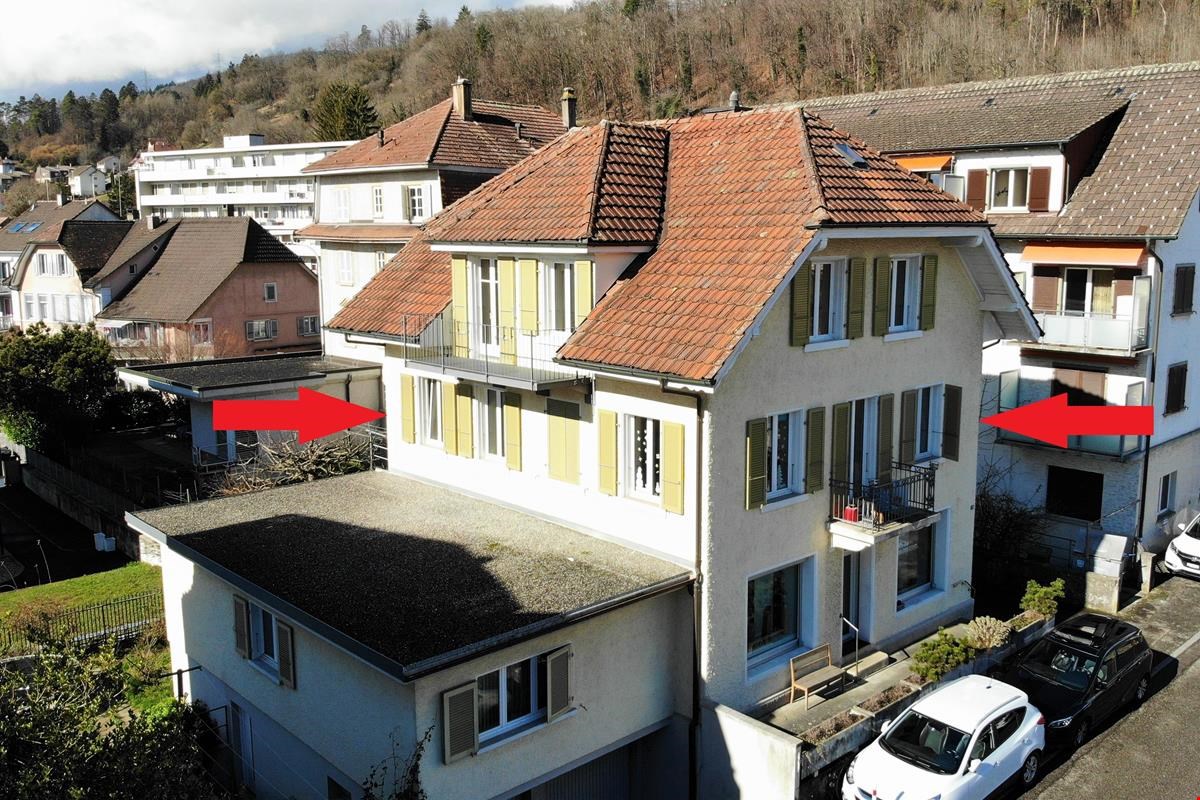two story house with two balconies
