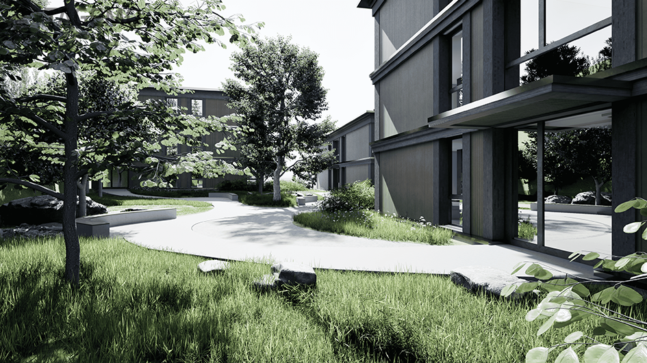Modern building with glass windows, concrete pathway, grassy area, trees, rocks, and a bench