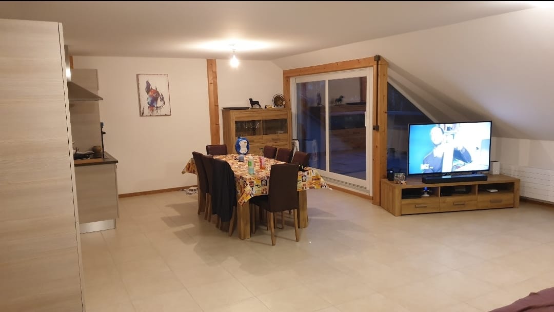dining table with chairs, flat screen tv, wooden tv unit, white ceiling, tiled floor