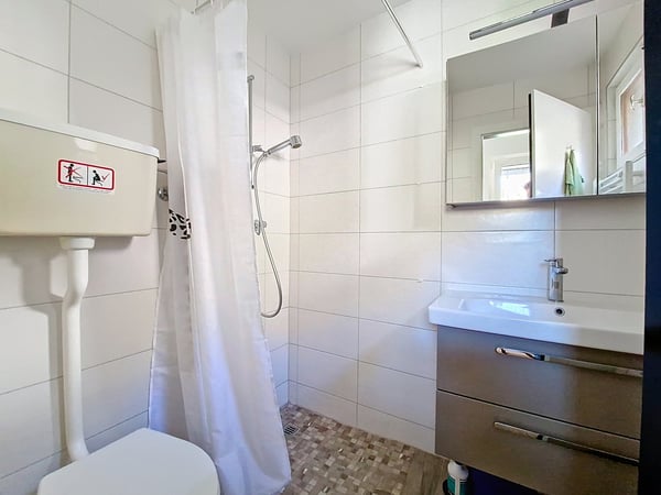 Flanthey – Charmante villa 1.5 pièces avec terrasse, pelouse et garage double 16