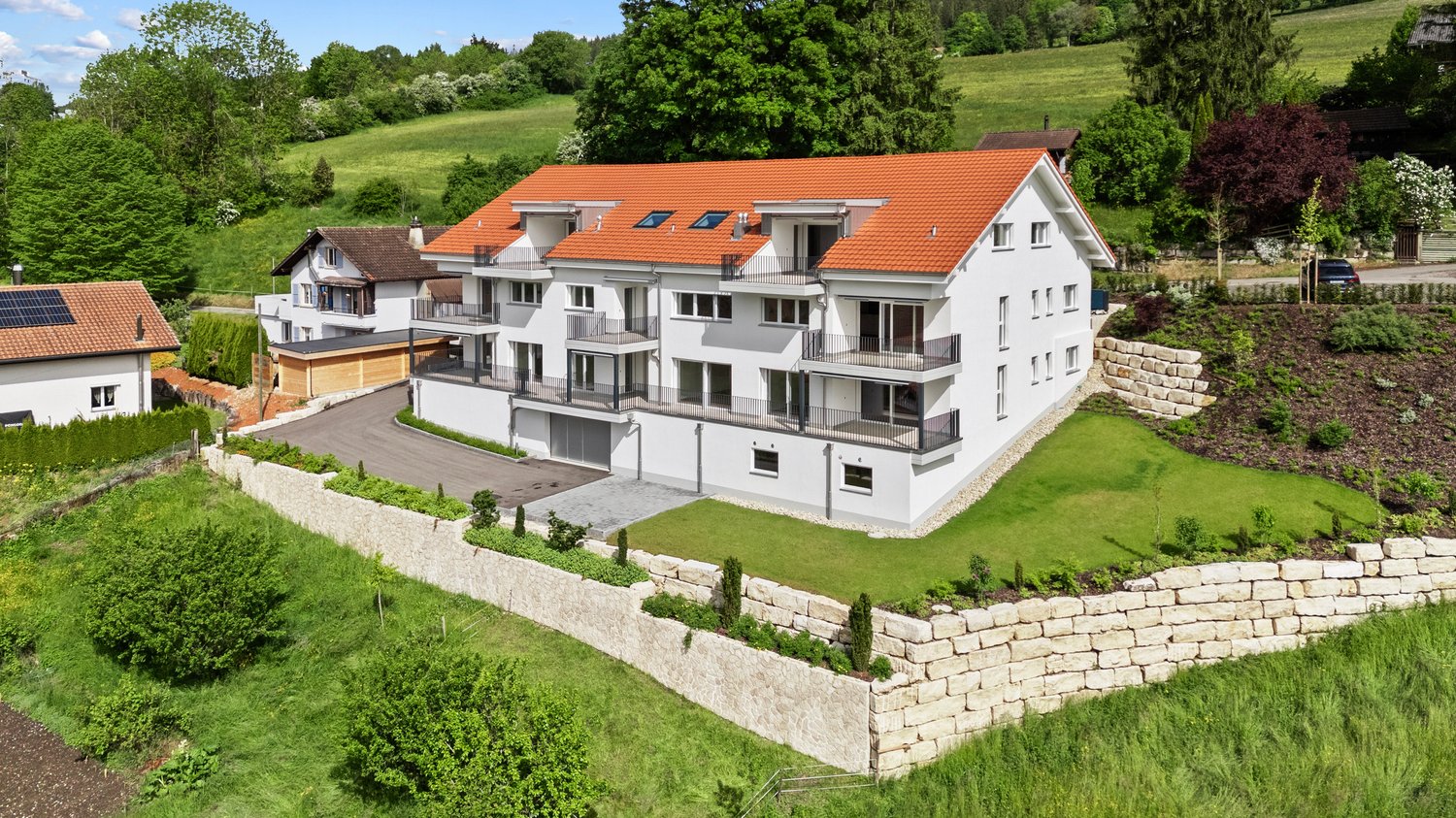 2 story house, red roof, garage, large terrace, landscaped garden