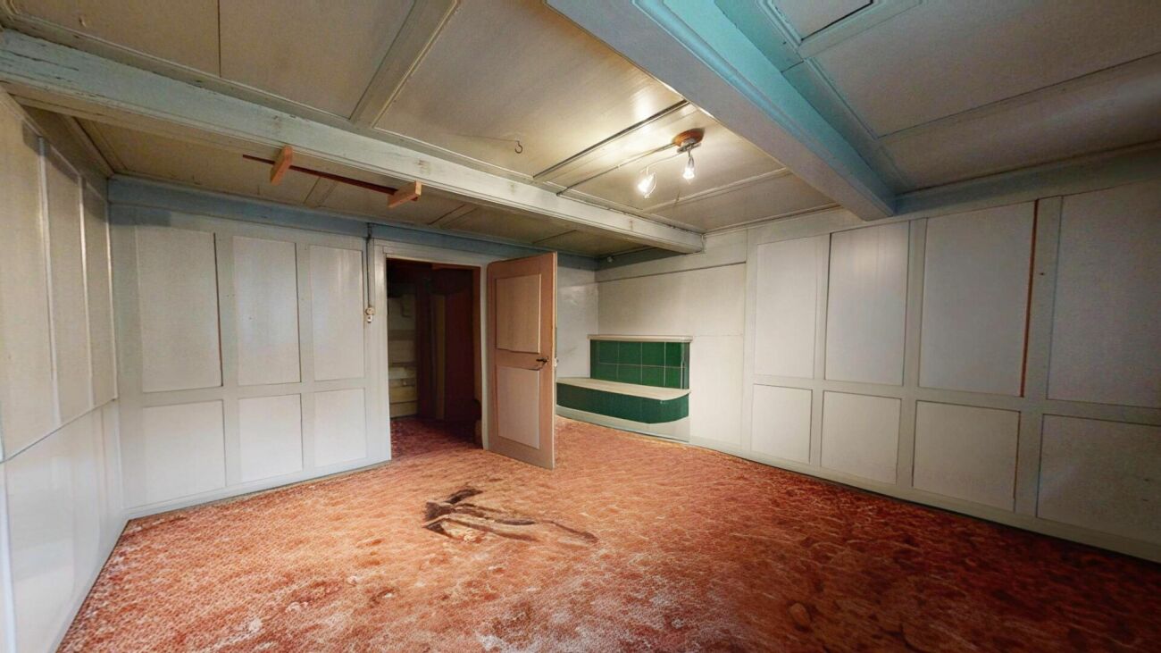 Two-family house with renovation needs and additional building land parcel
