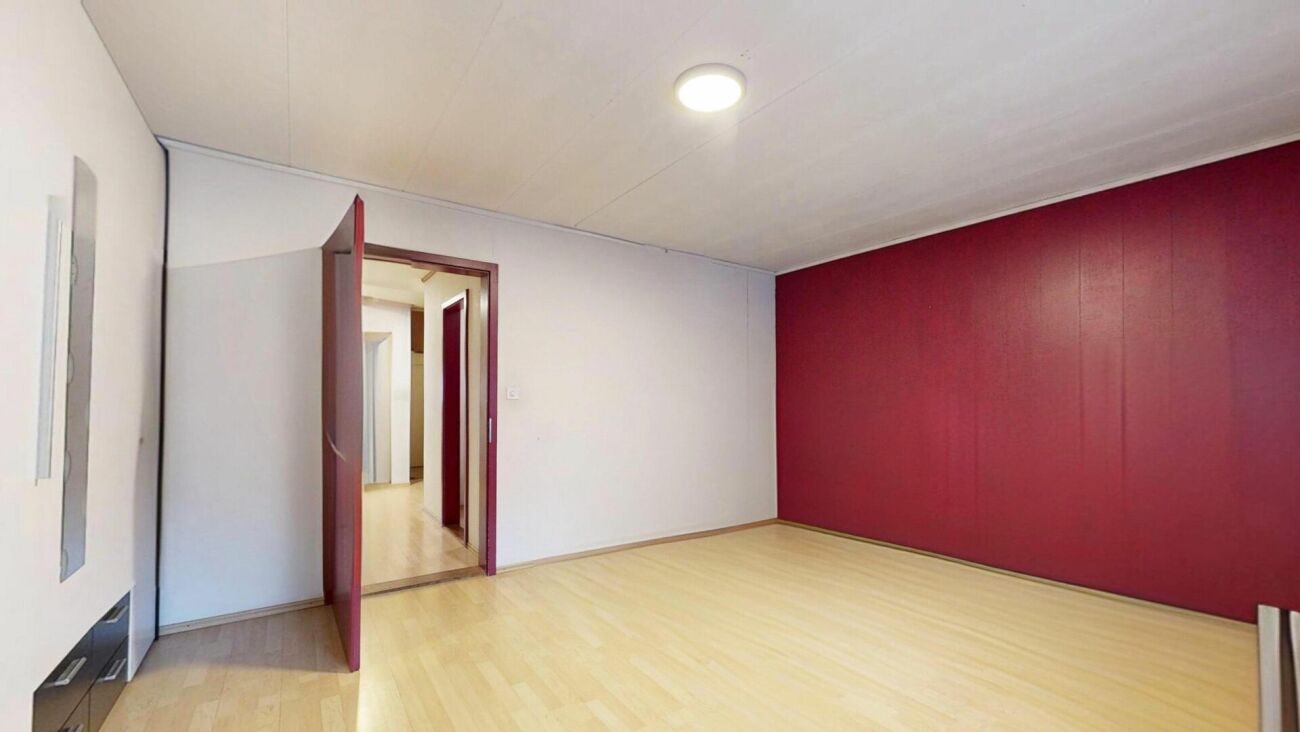 Two-family house with renovation needs and additional building land parcel