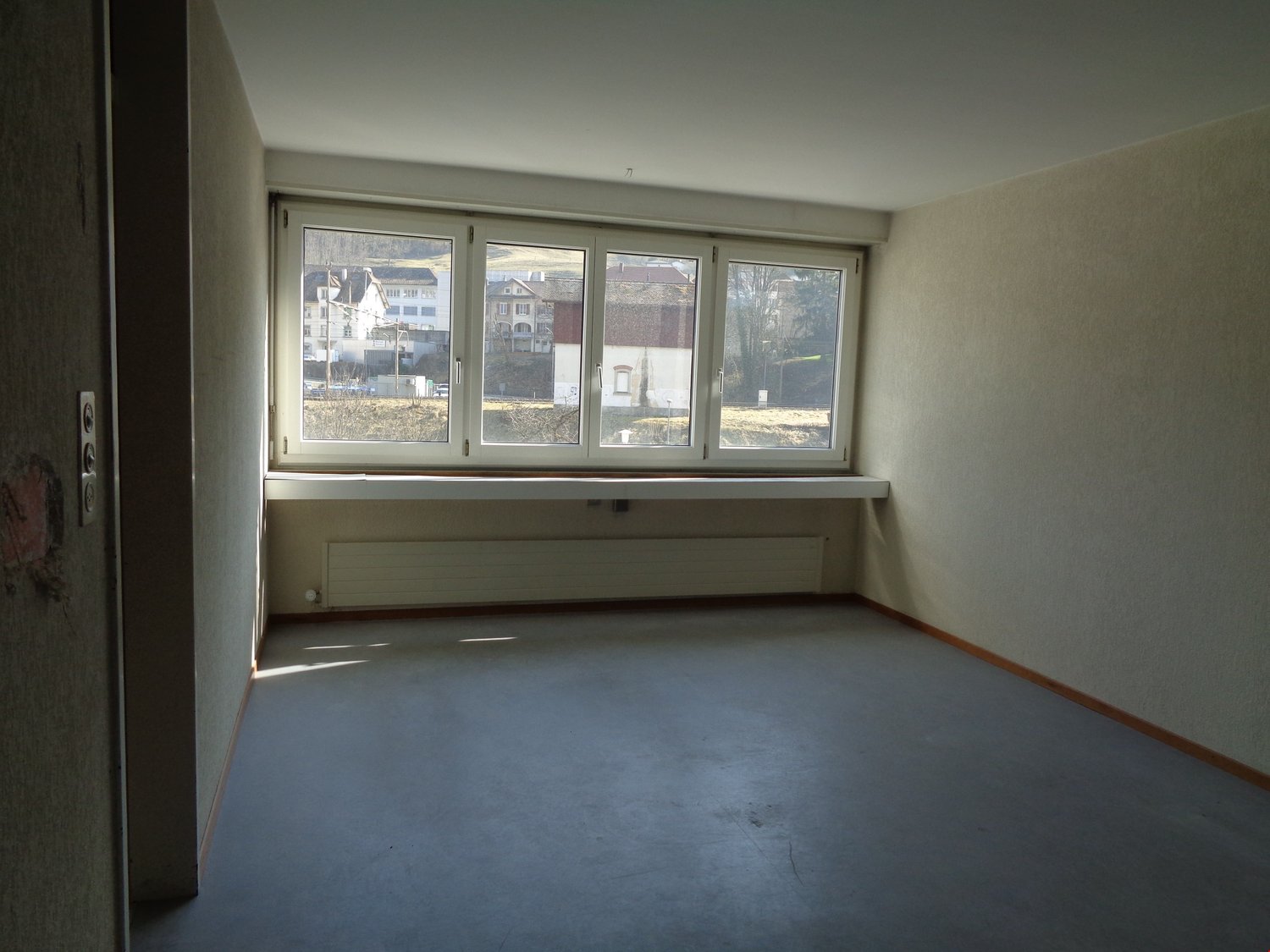 Empty room with windows and heating
