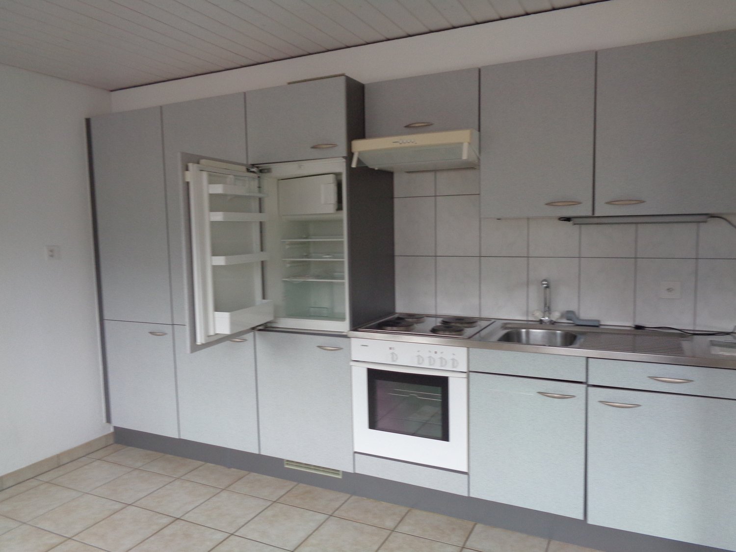 modern kitchen with refrigerator, sink, oven, stove, and dishwasher