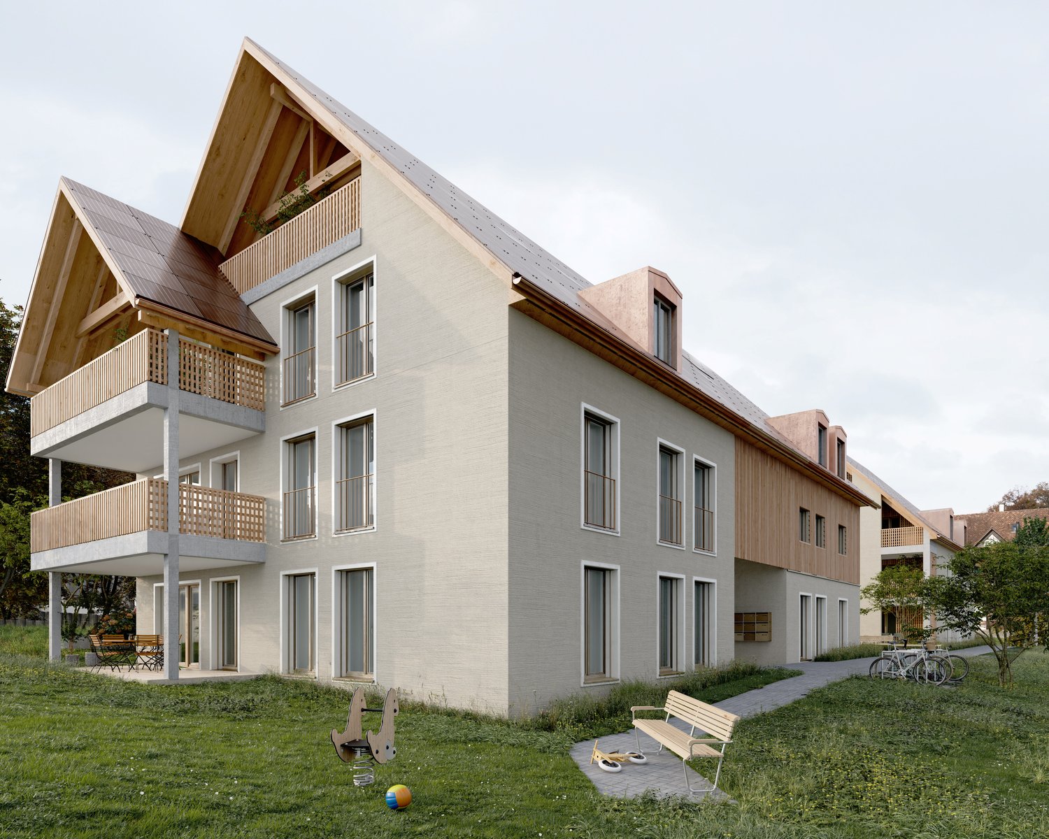 3-story apartment building with a modern, mixed-material design featuring wooden accents and balconies. The building has a grassy area with benches and toys, suggesting it may be a family-oriented residential complex.