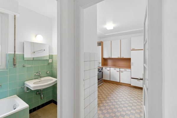 Dans un immeuble idéalement situé, proche de toutes commodités. 2