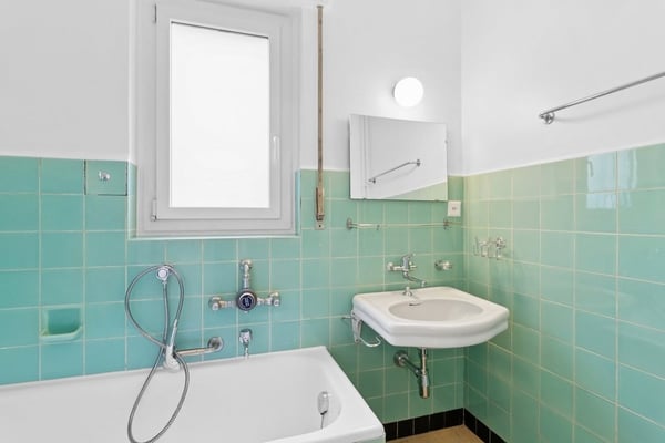 Dans un immeuble idéalement situé, proche de toutes commodités. 10