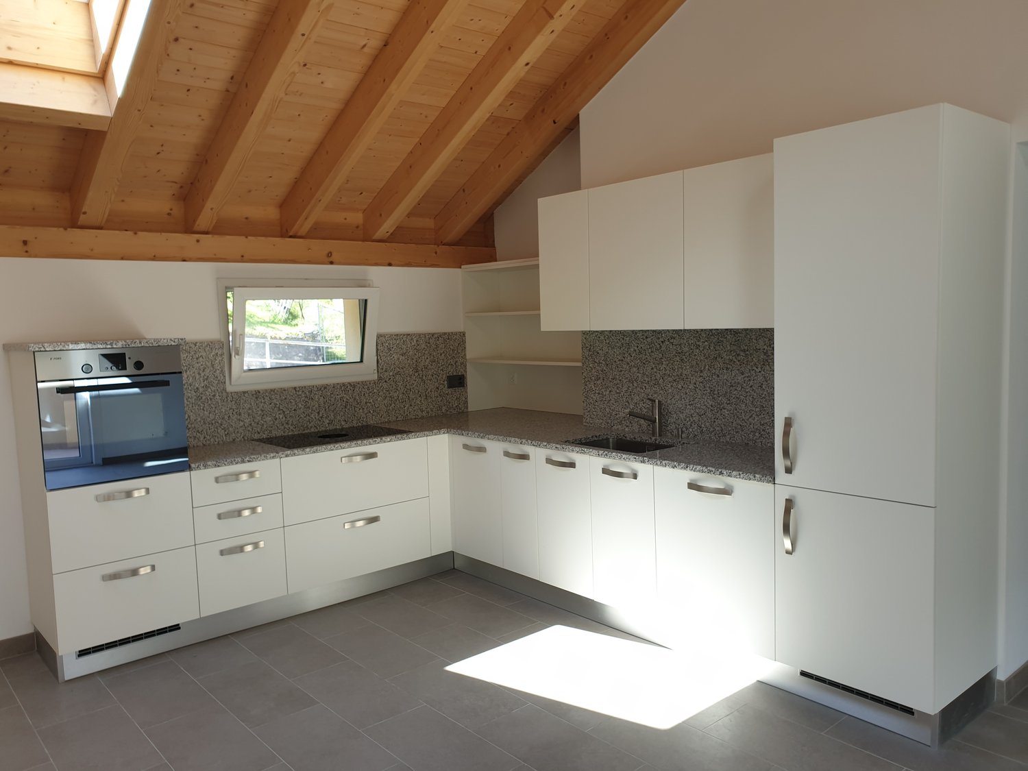 modern kitchen, white cabinets, marble countertop, stainless steel oven, granite floor