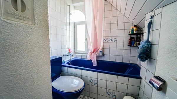 Charmantes Mehrfamilienhaus mit 8 Einheiten an zentraler Lage 9