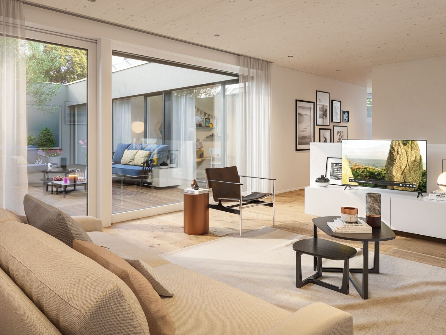 Spacious living room with large windows, hardwood floors, modern furniture including a sofa, coffee table, and armchair, wall decor, and access to a balcony or terrace.