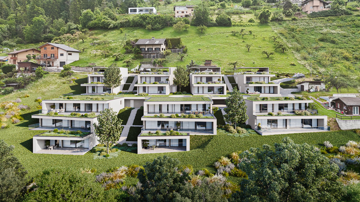 Modern apartment complex with green roofs, balconies, and raised ground floors