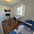 single bed, desk, flat screen tv, window, shelf, door
