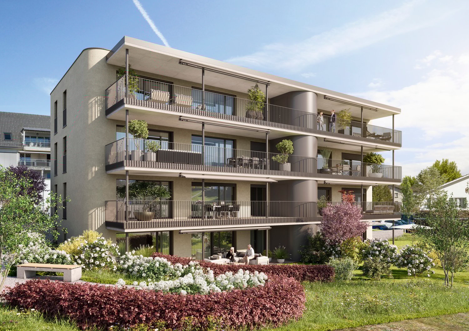 3-story apartment building with balconies, surrounded by a well-landscaped garden with flowers and greenery