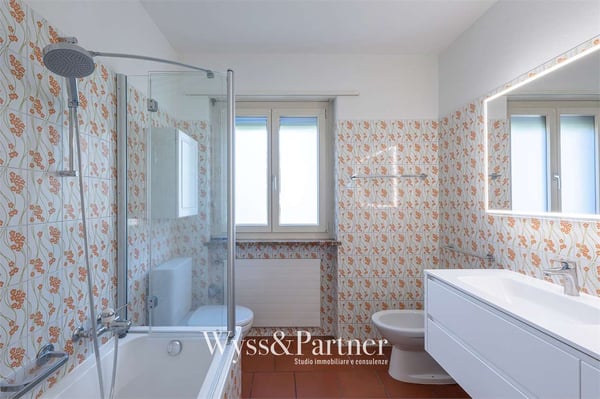 Casa su 3 livelli con terrazza e giardino a Vezia 10