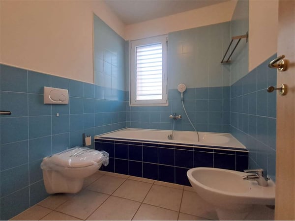 Melano: piacevole maisonette di 3,5 locali con terrazze e parcheggi 8