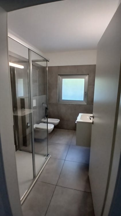 Moderno appartamento 2.5 locali con terrazza e giardino privato a Pazzallo 11
