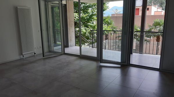 Moderno appartamento 2.5 locali con terrazza e giardino privato a Pazzallo 8