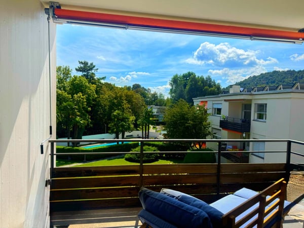 Il tuo rifugio nel verde a Ponte Capriasca: appartamento con piscina e giardino 1