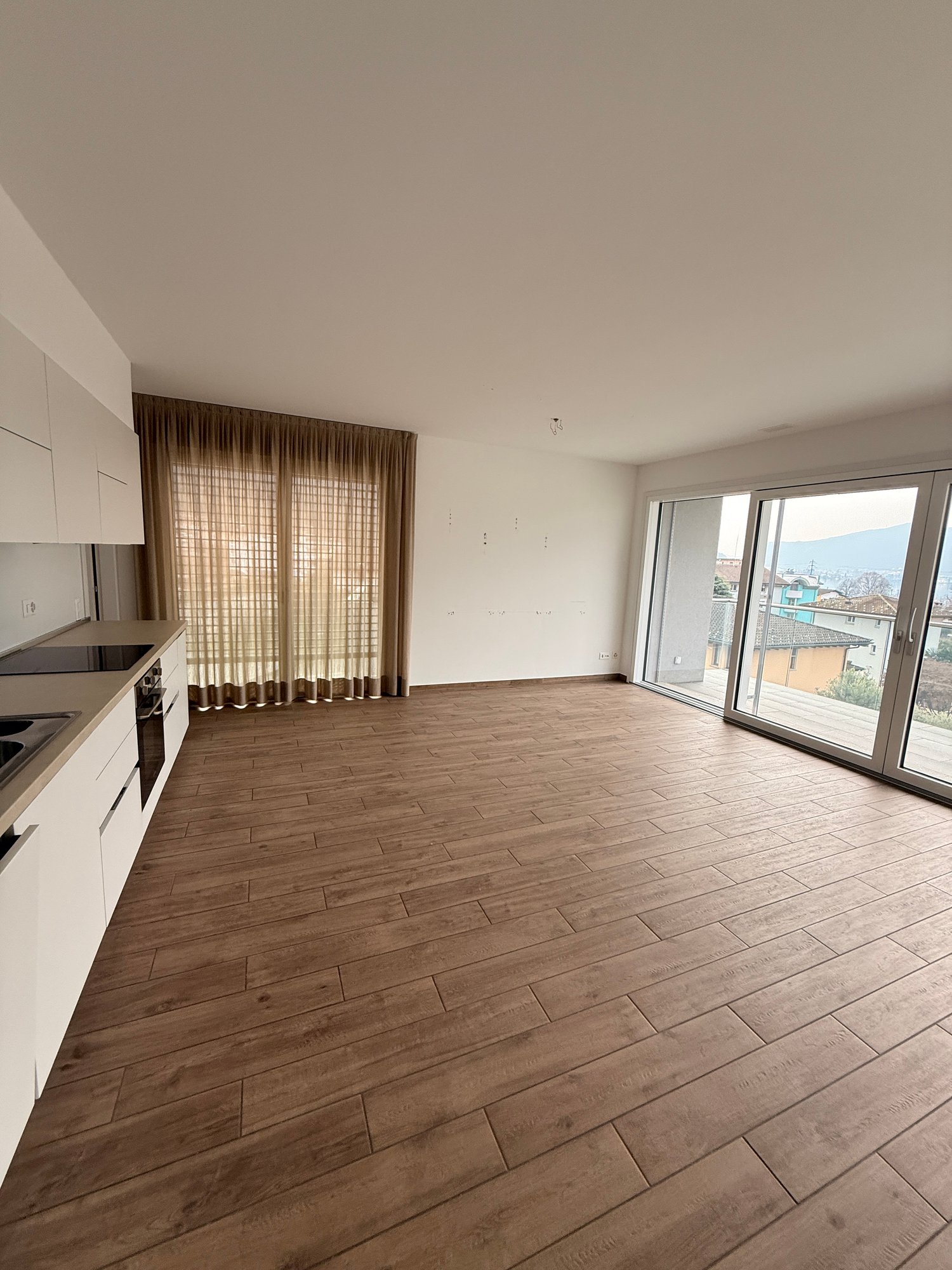 Modern minimalist kitchen, balcony, wooden flooring