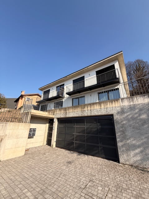 2 story house, garage, balcony with railing