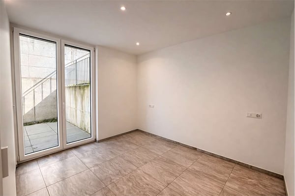 2,5 locali con giardino - Carabbia 9