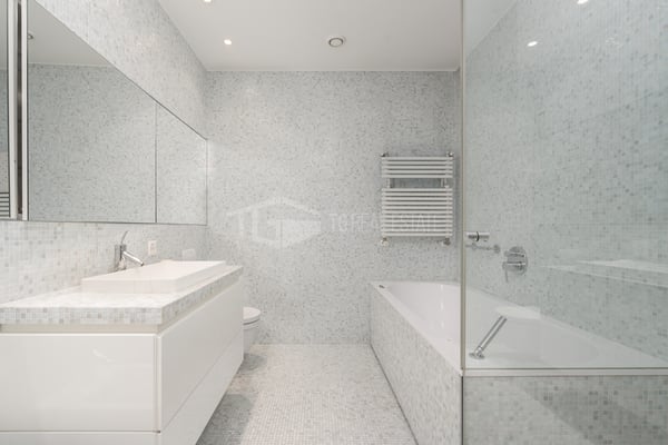 ELEGANTE ATTICO DI 3.5 LOCALI IN CENTRO LUGANO 11
