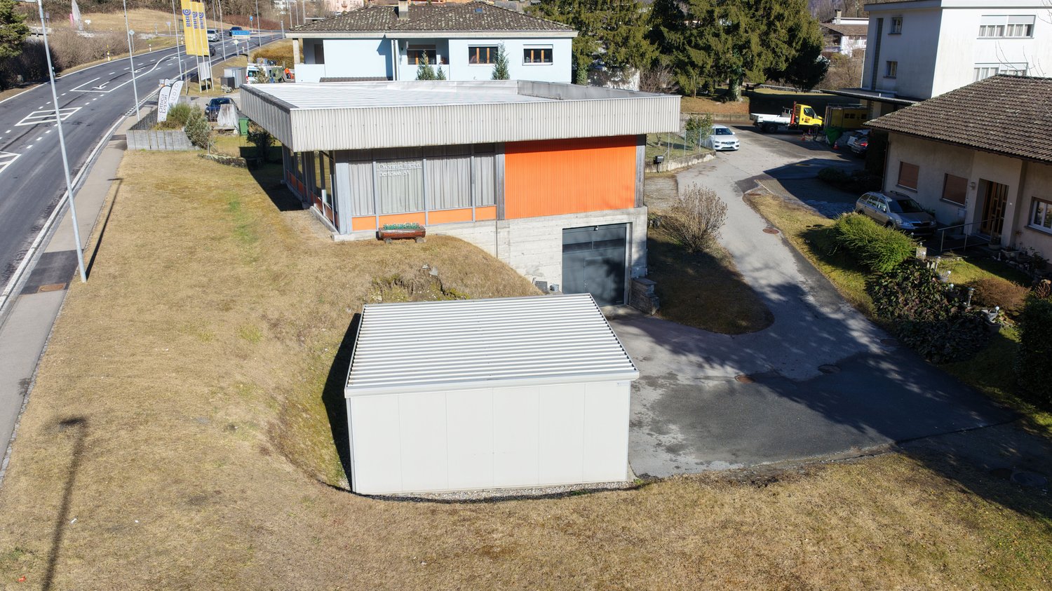 Modern style house, gray roof, orange part, 2 stories, garage