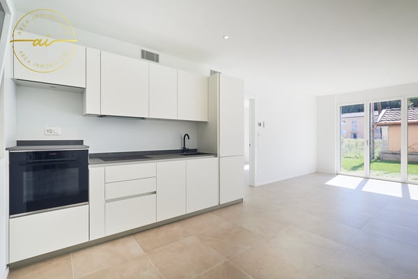 ELEGANTE 2.5 LOCALI DI NUOVA COSTRUZIONE CON GIARDINO 2