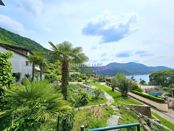 Wohnung in Villa: Erdgeschoss mit Garten, Terrasse und Seeblick