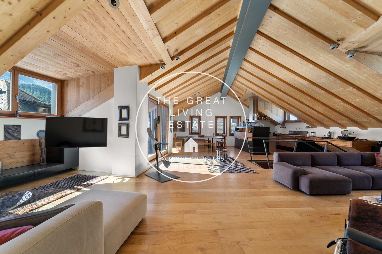 wooden ceiling, wooden floor, sofa, television, view of the mountains
