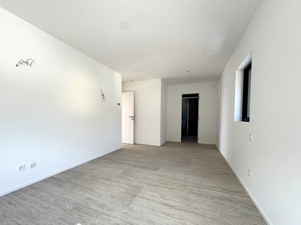 Elegante 1.5 locali al primo piano con terrazza e parziale vista lago 13