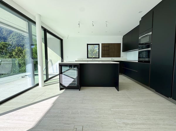 Elegante 4.5 locali al primo piano con terrazza e parziale vista lago 4