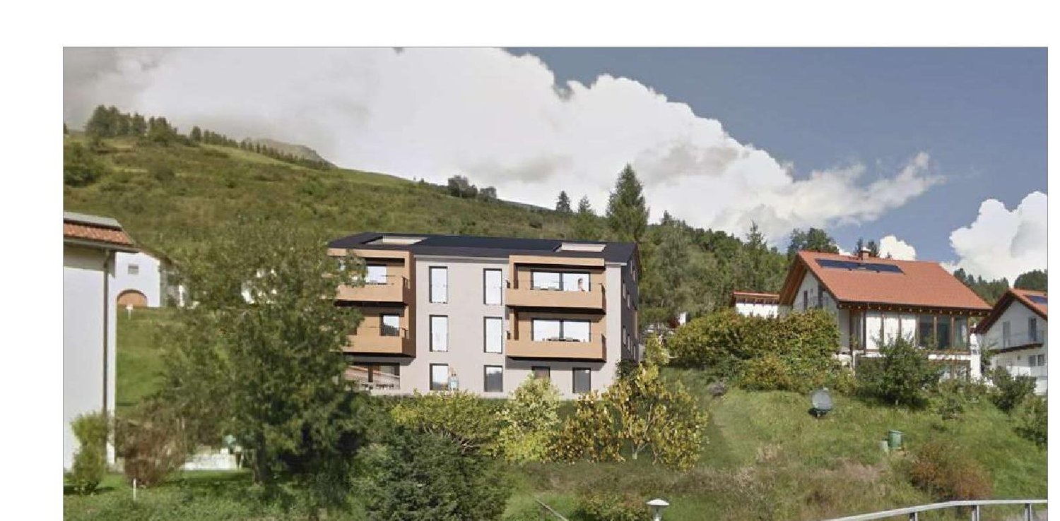 3-storey apartment building on hill, surrounded by greenery, large windows