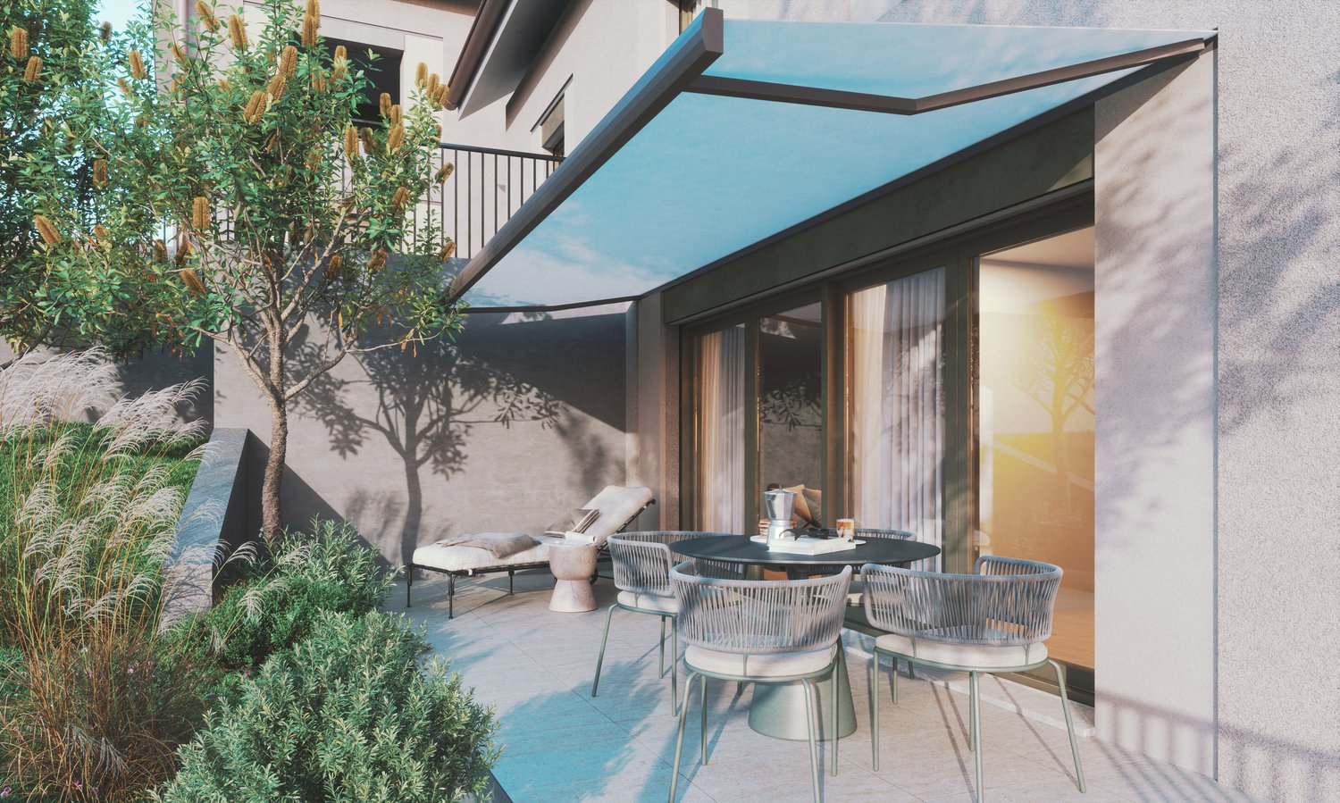 Outdoor patio with a table and chairs, a lounge chair, and a retractable awning.