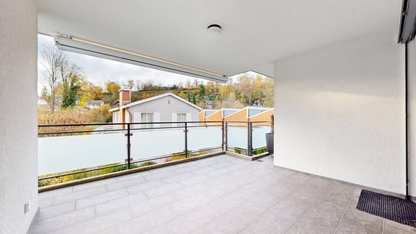 Attraktive 3,5-Zi.-Wohnung mit Balkon, Lift und Tiefgarage in zentraler Lage von Laufen 1