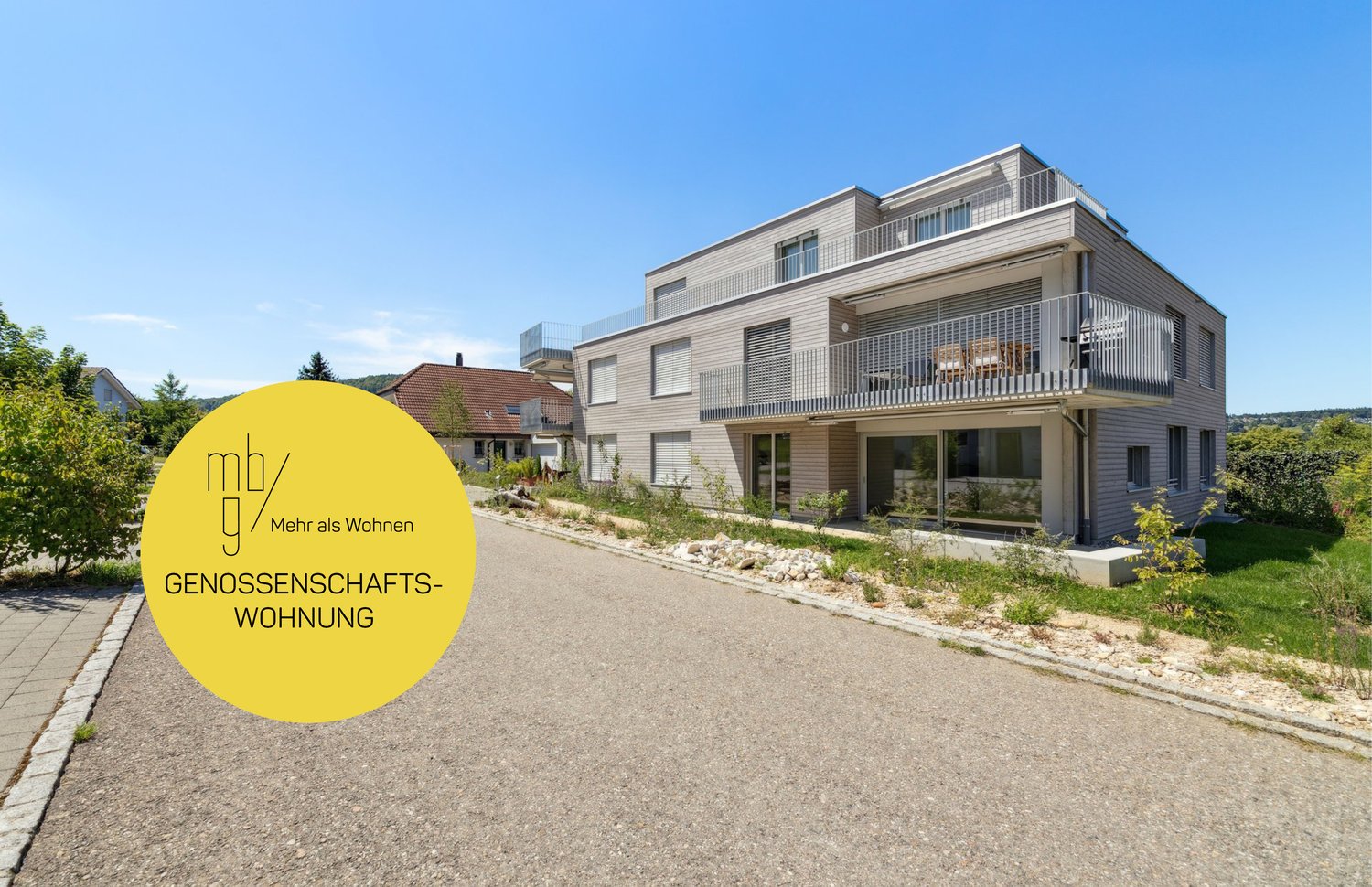 two story house, gray facade, white windows, balcony on second floor, driveway