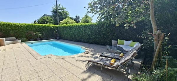 Nachhaltiges 7.5-Zimmer-Einfamilienhaus mit Photovoltaikanlage, Pool, Sauna & Fitness 1