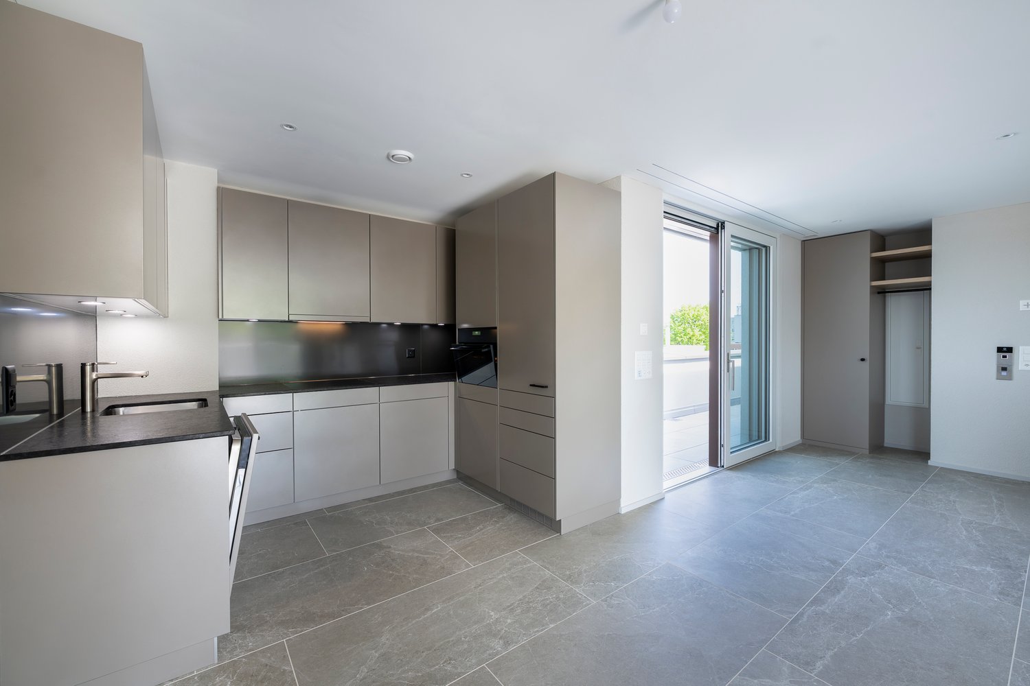 minimalistic design, modern appliances, granite countertop, stainless steel sink, large window