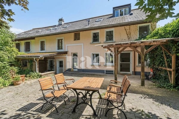 Maison jumelée de 6.5 pièces avec jardin à vendre à Sorens 1