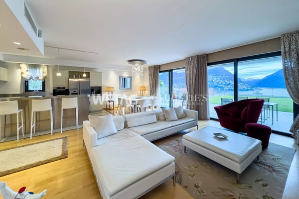 Zum Verkauf in Lugano: Moderne Duplex-Wohnung mit privatem Garten & herrlicher Seesicht, auch als Zweitwohnsitz möglich 3