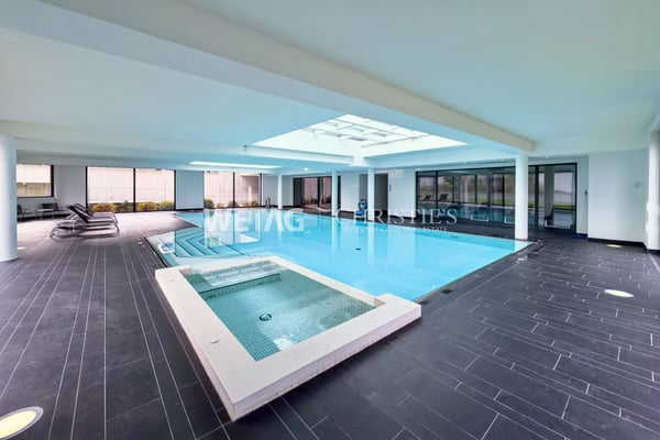 Zum Verkauf in Lugano: Moderne Duplex-Wohnung mit privatem Garten & herrlicher Seesicht, auch als Zweitwohnsitz möglich 13