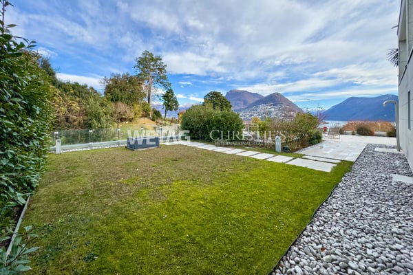 Zum Verkauf in Lugano: Moderne Duplex-Wohnung mit privatem Garten & herrlicher Seesicht, auch als Zweitwohnsitz möglich 11