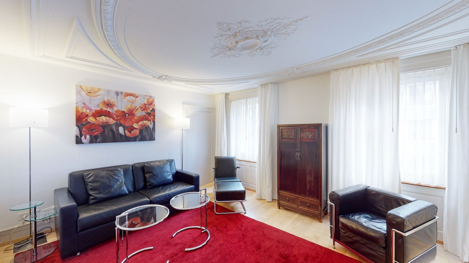 leather couch, glass tables, wooden cabinet, painting, red carpet