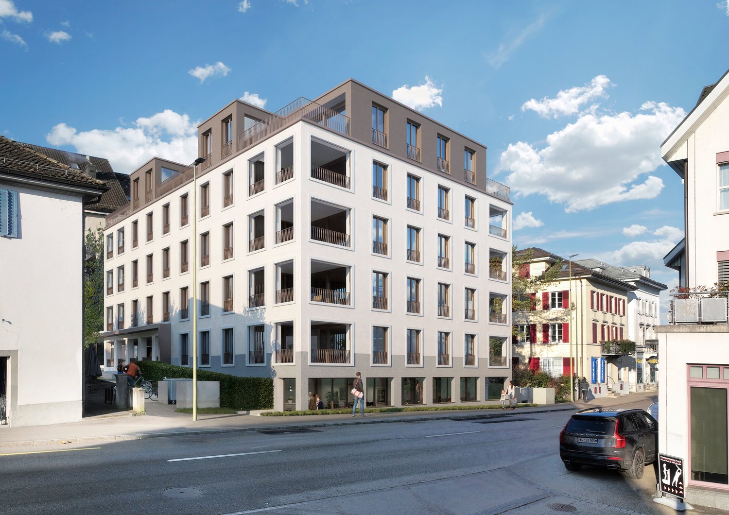 Residential apartment building, modern architecture, multiple floors, balconies, ground floor commercial spaces, and a parking area.