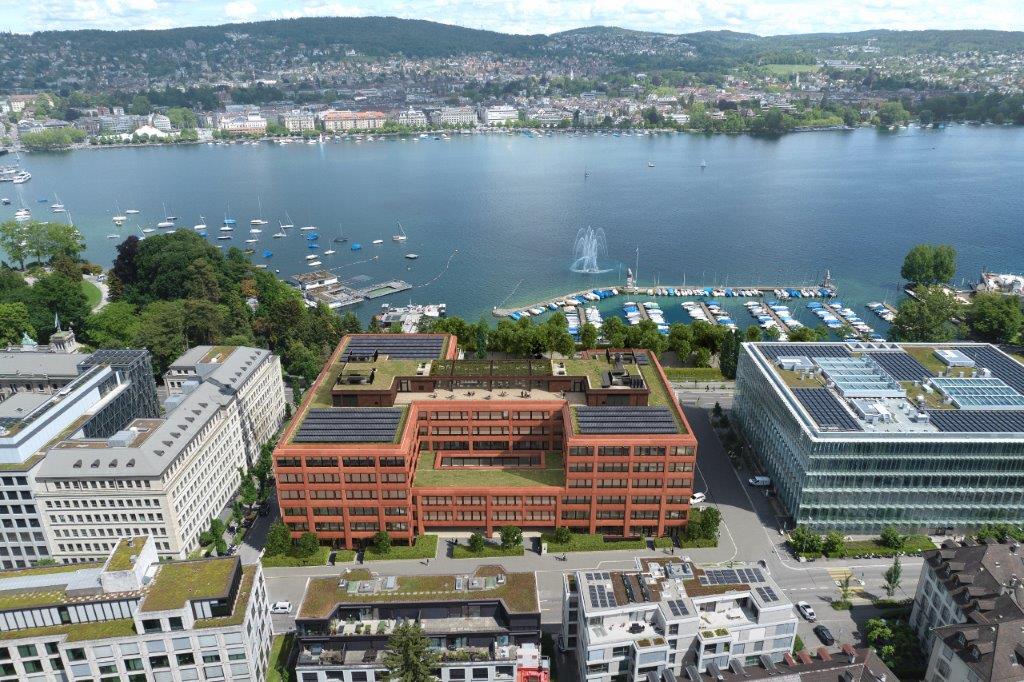 modern office building with solar panels, overlooking a large lake and a harbor