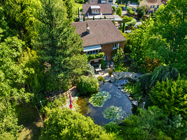 Idyllisches Zuhause in St. Gallen – Gartenparadies mit Schwimmteich 1