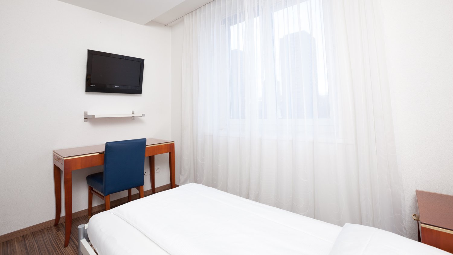bed, desk, chair, TV, outlet