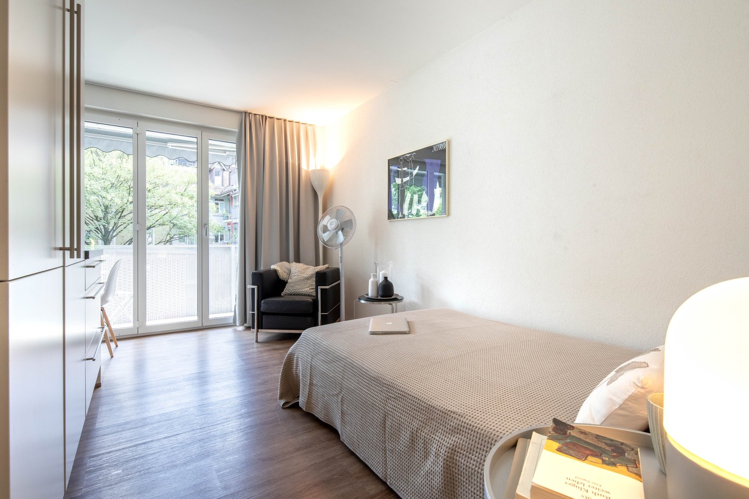 single bed, wooden floor, wardrobe, desk, bedspread, bed pillow, chair, table, window, lamp