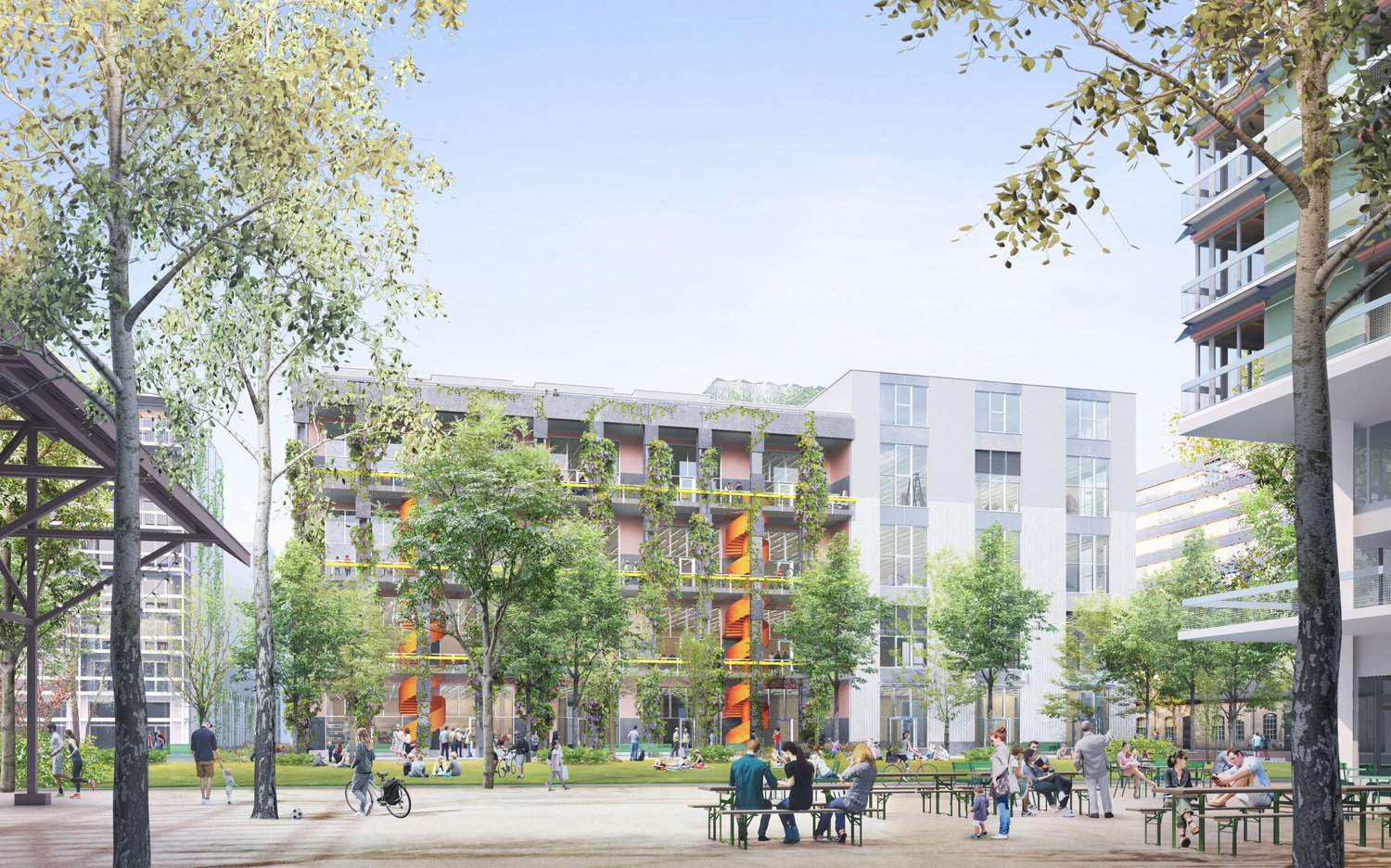 The image shows a modern residential complex with several multi-story buildings surrounded by trees and greenery. The buildings have balconies on the upper floors, and there is a central open space with people sitting at tables and benches, enjoying the o